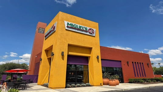 Image of the exterior of Miguel's Jr. Location in Tustin. CA
